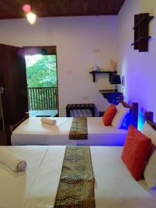 En eller flere senge i et værelse på Peek & Pick Garden resort