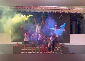 a group of people standing on a stage with their hands in the air at Costa Rica in Kumta