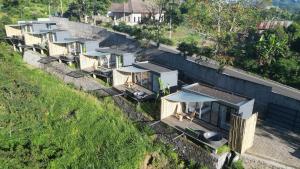 an overhead view of a row of houses on a hill at 7 Dreams Glamping in Kubupenlokan