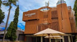 a building with an ak exchange center on it with an umbrella at Alexander Hotel Tegal in Tegal