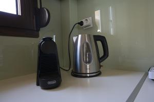 a coffeemaker sitting on top of a kitchen counter at Lidromi Home (Blue) in Alonnisos Old Town