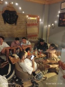 a group of people sitting in a living room at Buddha house 2 in Kasol +30 photos