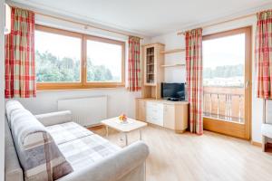 TV a/nebo společenská místnost v ubytování Pension Haus am See