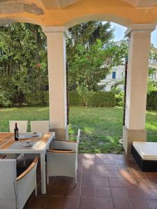 a patio with a table and chairs on a patio at Apartment Geidorf in Graz