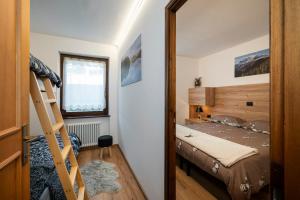 En eller flere senge i et værelse på Happiness 14