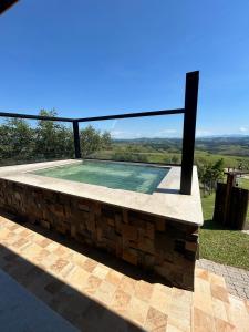 Swimmingpoolen hos eller tæt på Quarto Alto da Copaiba