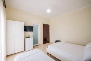 En eller flere senge i et værelse på Dashamiri's Villa