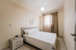 En eller flere senge i et værelse på Dashamiri's Villa