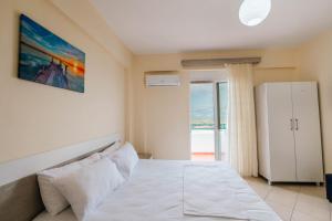 En eller flere senge i et værelse på Dashamiri's Villa