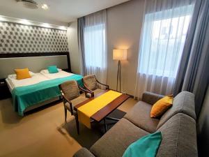 Postel nebo postele na pokoji v ubytování Hotel Zamek Centrum + 68 fotografií