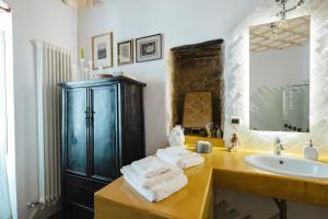 a bathroom with a sink and a counter with towels at Tenuta Rasocolmo in Messina +67 photos