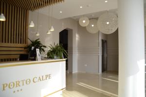 a lobby of a porto cafe with pendant lights at Hotel Porto Calpe in Calpe