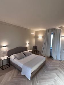 Postel nebo postele na pokoji v ubytování L'Orangerie