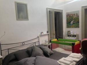 a living room with a couch and a table at Your Home in Town in Catania