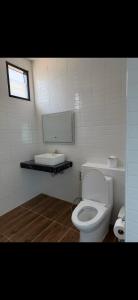 a bathroom with a white toilet and a sink at Love koh tao villa 2 in Koh Tao