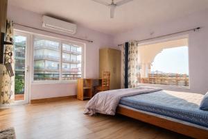 Postel nebo postele na pokoji v ubytování Om Homestay