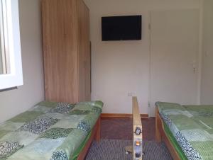 En eller flere senge i et værelse på Vila Jezerce Zlatibor Zbojštica