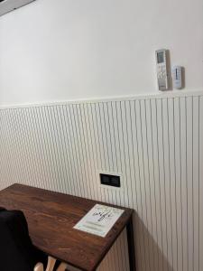 a table with a sign on it next to a wall at Las casitas de Canggu in Canggu +25 photos
