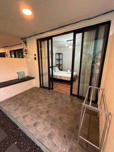 a room with a view of a bedroom at Las casitas de Canggu in Canggu