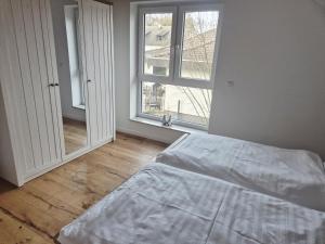 Postel nebo postele na pokoji v ubytování Ferienhaus Valle Verde in Kall-Steinfeld