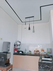 Køkken eller tekøkken på Kangen Sawah Cottage Syariah