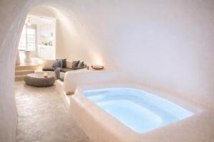 a large bath tub in a living room at Yposkafon Concept Two-Bedroom Villa with Private Jacuzzi and Hamam in Megalochori +117 photos