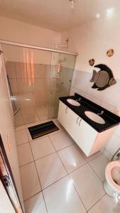 Et badeværelse på Loft Rústico com Vista Para a Piscina