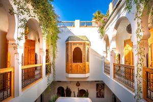 a courtyard with a mosque in a building at Riad LallaBaya in Marrakesh