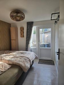 En eller flere senge i et værelse på Zandkasteel Domburg