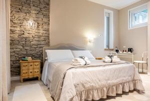 a bedroom with a bed with towels on it at Residence Briona in Domodossola