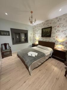 a bedroom with a bed with two towels on it at The White House in Calafell +37 photos
