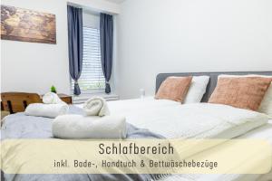 En eller flere senge i et værelse på Jasminkas Host 3 - Stadtwohnung mit Küche & gratis Parkplatz