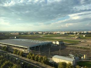 a large building with a field and a city at Panoramic Sea Suites II By VALENCIAFLATS EU in Valencia +7 photos