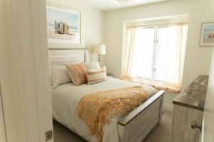 a bedroom with a bed and a window at 114 Austin Ave, Unit 11 in Wildwood