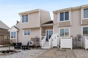 a house with a white door in front of it at 114 Austin Ave, Unit 11 in Wildwood