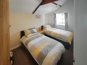 En eller flere senge i et værelse på The Old Engine House + 4 billeder