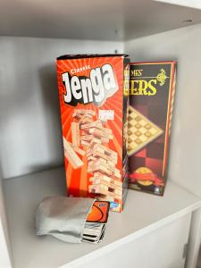 two boxes of candy on a shelf in a drawer at LIUxSAU apartmentai in Mažeikiai