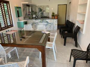 a dining room with a table and chairs at Elysian in Mananthavady