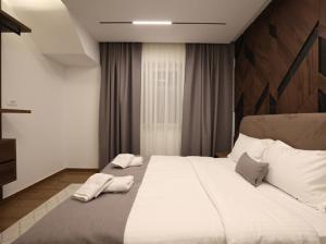 Postel nebo postele na pokoji v ubytování De La Villa Brezovice