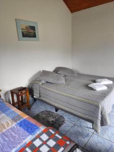 En eller flere senge i et værelse på Pousada e Restaurante Além das Nuvens + 21 billeder