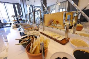 a buffet line with food on a counter with food at Rest by Dedeman Elbistan in Elbistan