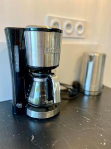 a blender sitting on top of a counter at L'esprit vacances-T3 à Port La Forêt in La Forêt-Fouesnant +17 photos