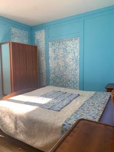 En eller flere senge i et værelse på Al Sole di Fiemme Apartment