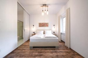 En eller flere senge i et værelse på Club Alpenresidenz Gastein