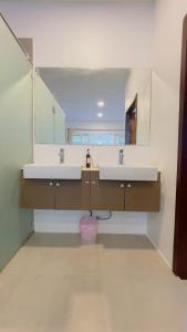 a bathroom with two sinks and a mirror at Beautiful Bungalow 5, Koh Chang in Ban Dan Mai +5 photos