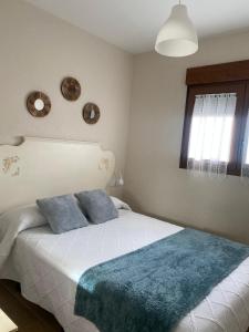 Postel nebo postele na pokoji v ubytování La Cuesta Verde. Mini hogar