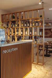 a bar in a room with bottles of wine at Dastan Boutique Hotel Baku in Baku