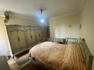 a bedroom with a bed in a room at Ramo Square hostel in 6th Of October