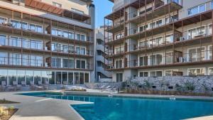 an image of an apartment building with a swimming pool at Departamento BOSQUE - Unidad 218 in Costa del Este