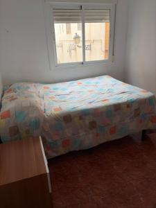 En eller flere senge i et værelse på Tierra mía